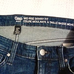 - GAP Mid-rise Girlfriend Jeans